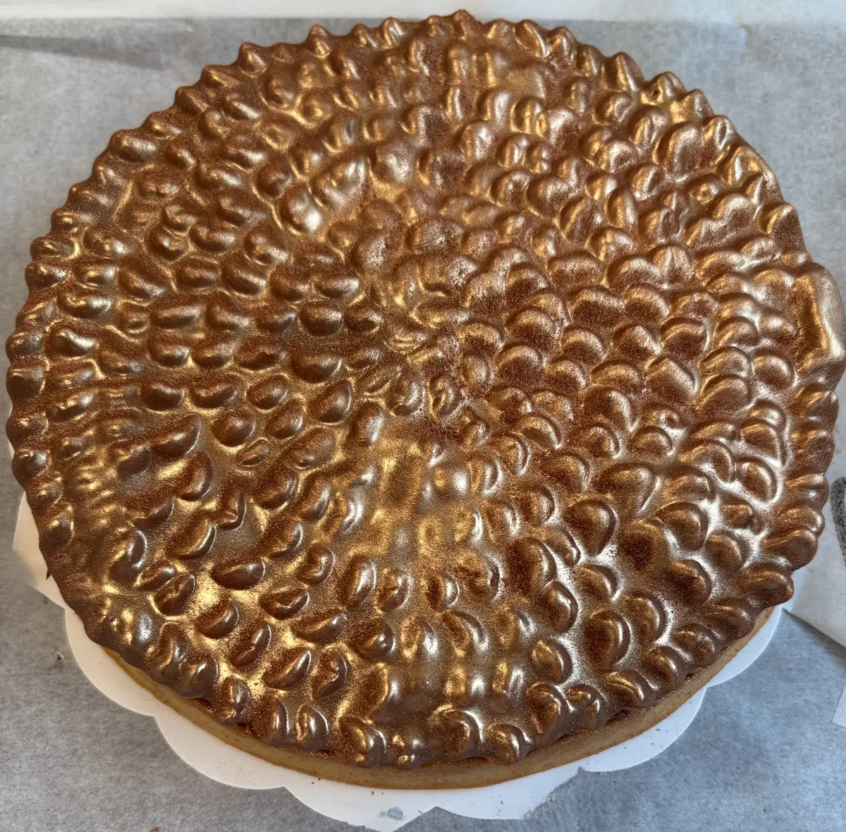 Ali's bronze-glazed signature pastry, photographed from above.