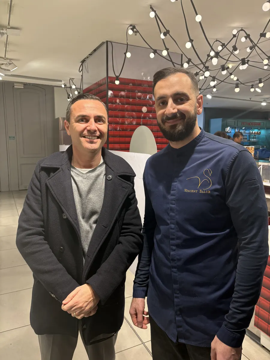 Ali Al Ghoul with a master chef at a Paris culinary venue.
