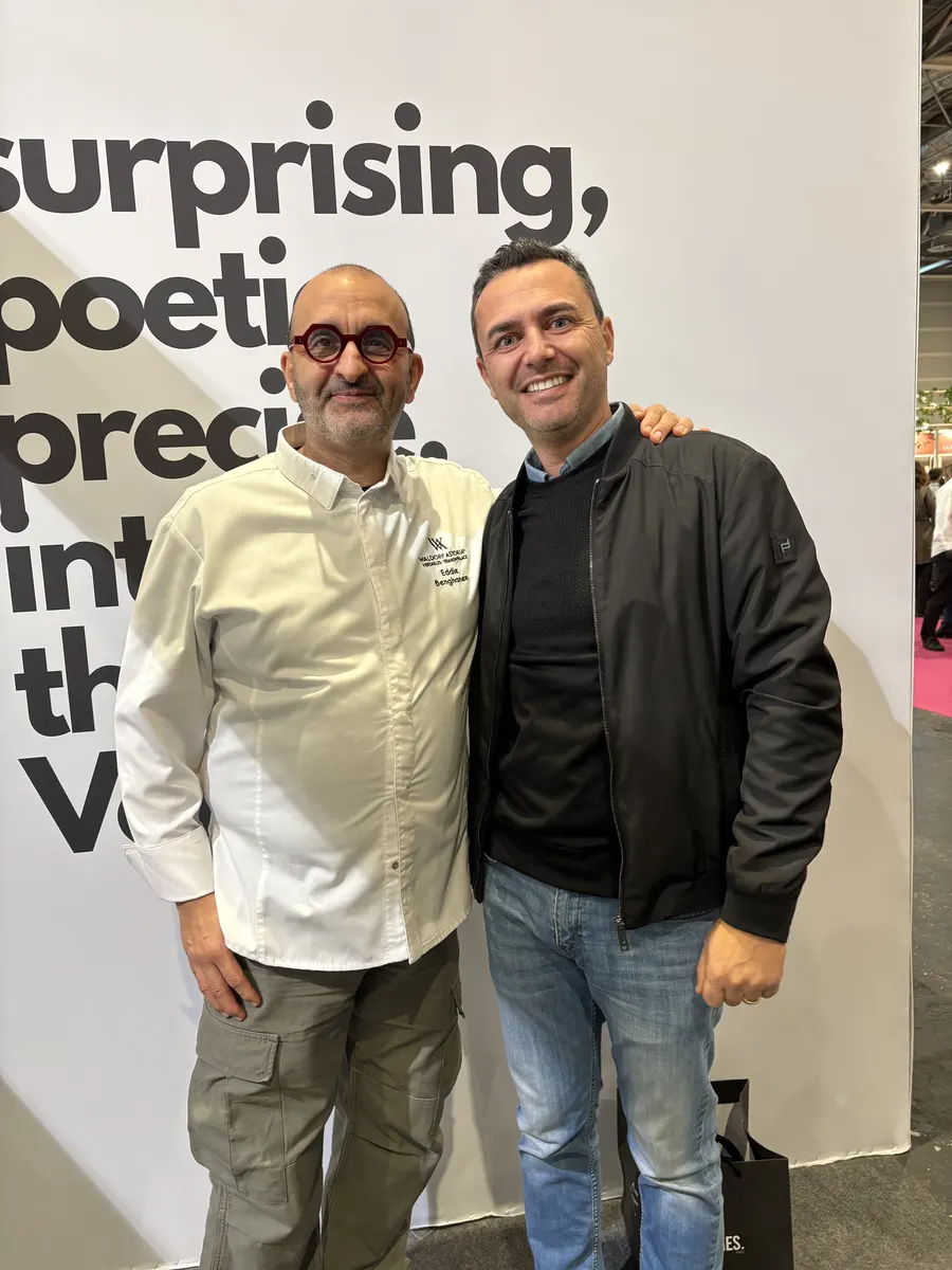 Ali Al Ghoul with a senior Parisian pastry master at a culinary event in Paris.